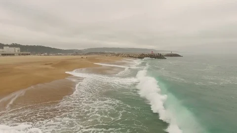 Beautiful empty ocean sandy beach in Nazar , Portugal. Aerial view Stock Footage 80900067