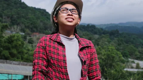 Beautiful engineer at work, imagining new project plans on the mountain. Stock Footage 172391537