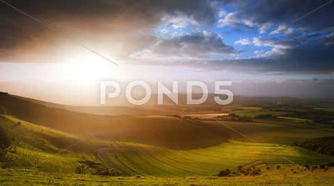 Beautiful english countryside landscape over rolling hills Stock Photos