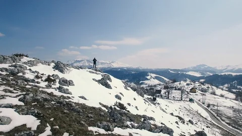 Beautiful Epic Scale Mountain Range Man Standing On Top Of Cliff Edge Stock Footage 88137691