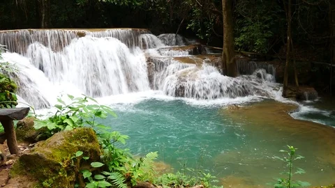 Beautiful Erawan Waterfall in the rain forest, famous tourist attractions Stock Footage 83202024