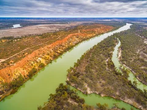 Beautiful eroding orange sandstone cliffs looming over the iconic Murray RIve Stock Photos