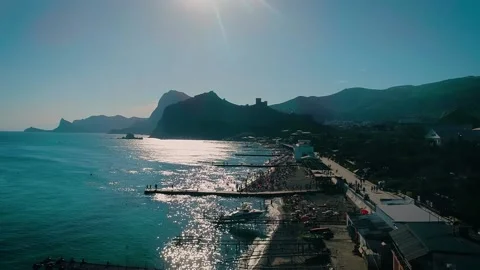 Beautiful evening beach with people having a rest. Stock Footage 150904625