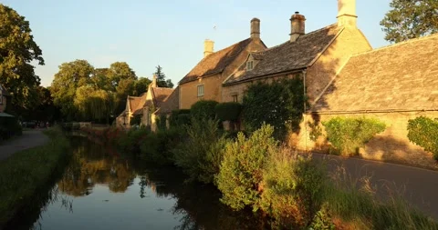 Beautiful Evening Light in the village of Lower Slaughter, Cotswolds AONB, UK Stock Footage 346144227