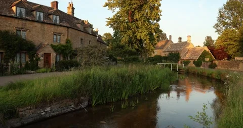 Beautiful Evening Light in the village of Lower Slaughter, Cotswolds AONB, UK Stock Footage 346144457
