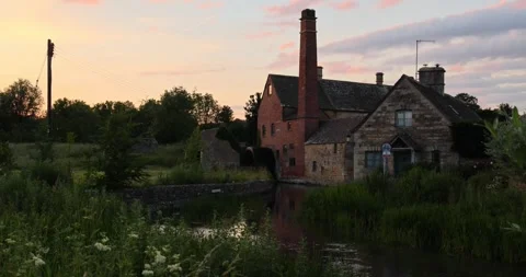 Beautiful Evening Light in the village of Lower Slaughter, Cotswolds AONB, UK Stock Footage 346145371