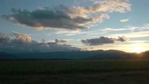 Beautiful evening sky and open grassy field Video stock 140610608