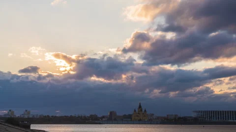 Beautiful evening sky. Dramatic sunset. Sun rays emerge through the clouds. Video stock 217523674