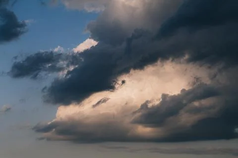 Beautiful evening sky with multi-colored bright clouds. Rain clouds at sunset Stock Photos