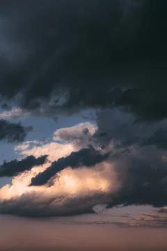 Beautiful evening sky with multi-colored bright clouds. Rain clouds at sunset Stock Photos