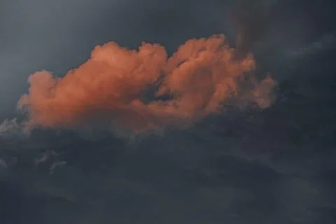 Beautiful evening sky with multi-colored bright clouds. Rain clouds at sunset Stock Photos