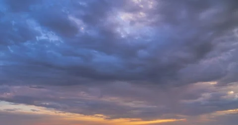 Beautiful evening sky. Sun rays emerge through the clouds at sunset. Stock Footage 255800165