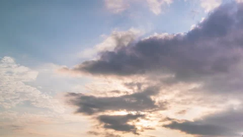 Beautiful evening sky. Sun rays emerge through the clouds at sunset. Stock Footage 255851591