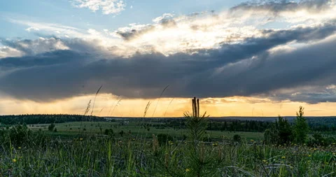 Beautiful evening sunset, time lapse, movement of clouds of a different level Stock Footage 133370389
