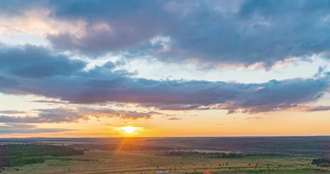 Beautiful evening sunset, time lapse, movement of clouds of a different level Stock Footage 135357982