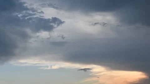 Beautiful evening time-lapse of dark rainy and orange clouds Stock Footage 154016426