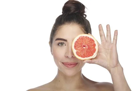 Beautiful exotic model with grapefruit slice. Stock Photos