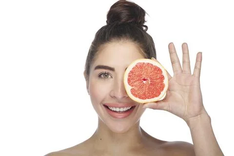 Beautiful exotic model with grapefruit slice. Stock Photos