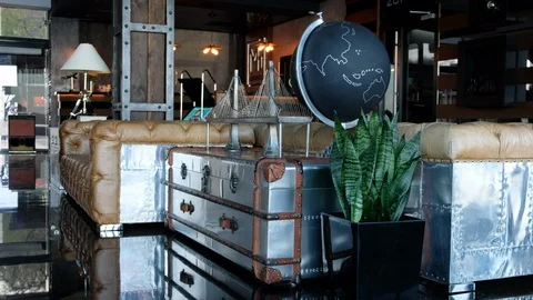 Beautiful expensive interior in loft style. Vintage suitcases and interior Stock Footage 110656175