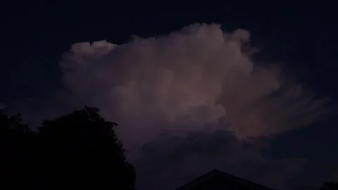 Beautiful explosive looking cloud at dusk with a bolt of lightening Stock Footage 303749210