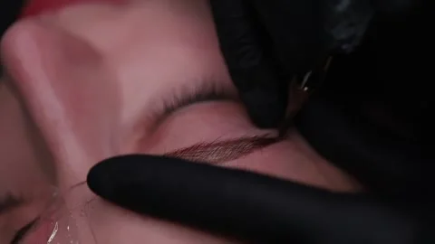 Beautiful eyebrows with permanent makeup Stock Footage 252591998