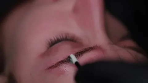 Beautiful eyebrows with permanent makeup Stock Footage 252592094