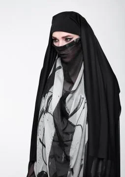 Beautiful eyes woman wearing fashion burka on grey background Stock Photos