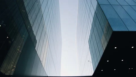 The beautiful facade of an office building with a reflection of the dawn sky. Stock Footage 152021053