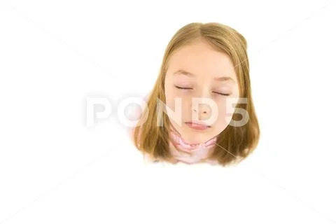 The beautiful face of the little girl. View from above Stock Photos