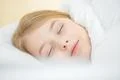 The beautiful face of the young girl on the pillow Photo