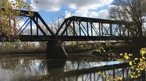 Beautiful Fall Shot train crossing historic bridge Ft Wayne Indiana Stock Footage 63964603