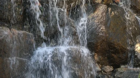 Beautiful falling streams of a mountain waterfall Stock Footage 125555191