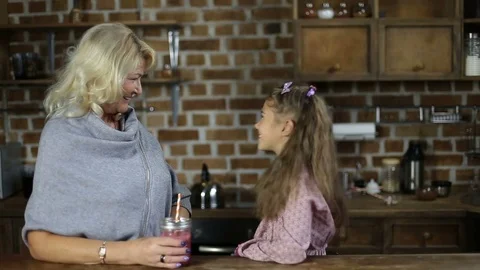 Beautiful family having breakfast in the kitchen Stock Footage