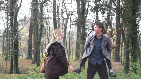 Beautiful family having fun in the park Stock Footage 59553938