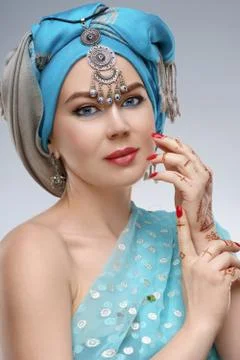 Beautiful fashion east  woman portrait with oriental accessories- earrings, b Stock Photos