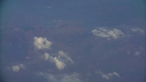 Beautiful fast-sailing clouds on a Sunny day, shooting from aircraft Stock-Footage 99452955