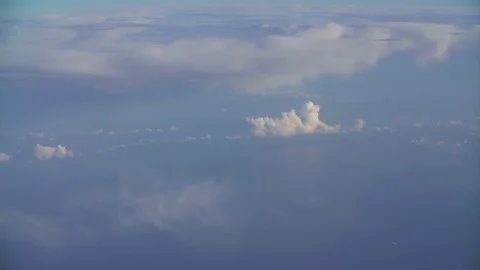 Beautiful fast-sailing clouds on a Sunny day, shooting from aircraft Stock Footage 99452990