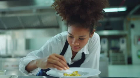Beautiful female chef looking to camera with smile at modern kitchen. Stock Footage 232286165