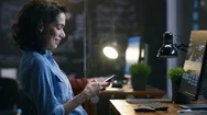 Beautiful Female Financier Uses Mobile Phone, Writing Messages, Emails Stock Footage