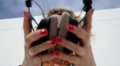 Beautiful Female with Headphones Enjoying Music Outdoors. HD Footage
