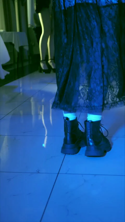Beautiful female legs dancing on the dance floor in the club, rear view Stock Footage 307766009