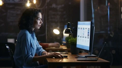 Beautiful Female Mobile Video Gaming Application Developer Works at Her Desk. Stock Footage