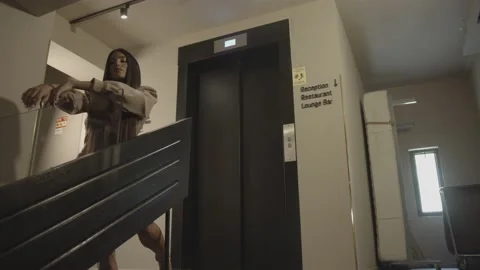 A beautiful female model in the elevator, shooting session Stock Footage 139488173
