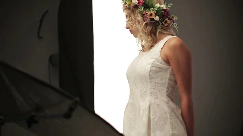 Beautiful female model posing at studio in the light flashes Stock Footage 73777620