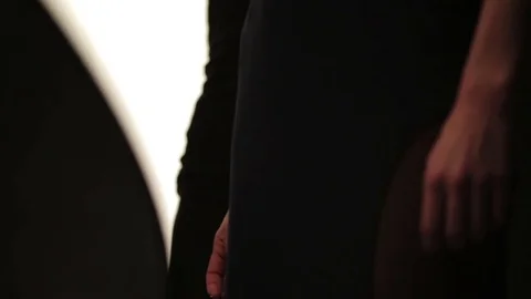 Beautiful female model posing at studio in the light flashes Stock Footage 73779171