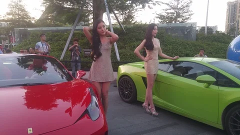 Beautiful female models at the weekend square auto show Video stock 97417822