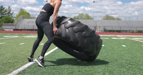 Beautiful Female Physical Trainer Exercising Working Out Cross Fit Large Tire 스톡 동영상 154384563