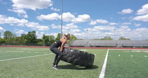 Beautiful Female Physical Trainer Exercising Working Out Cross Fit Large Tire 스톡 동영상 154384564
