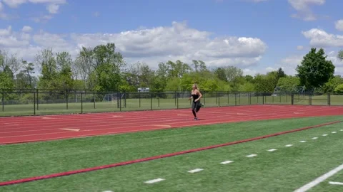 Beautiful Female Physical Trainer Working Out Running on Track Aerial Drone Stockbeeldmateriaal 154384382