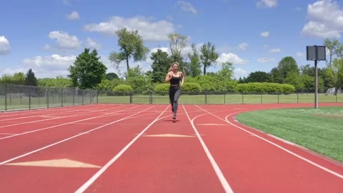 Beautiful Female Physical Trainer Working Out Running on Track Aerial Drone 스톡 동영상 154384387